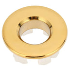Gold bathroom wash basin sink hole overflow cover with polished metallic finish and white plastic mounting flanges
