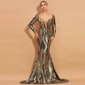 Gold and black sequined mermaid gown with long sleeves and deep v-neckline perfect for waist slimming banquet events