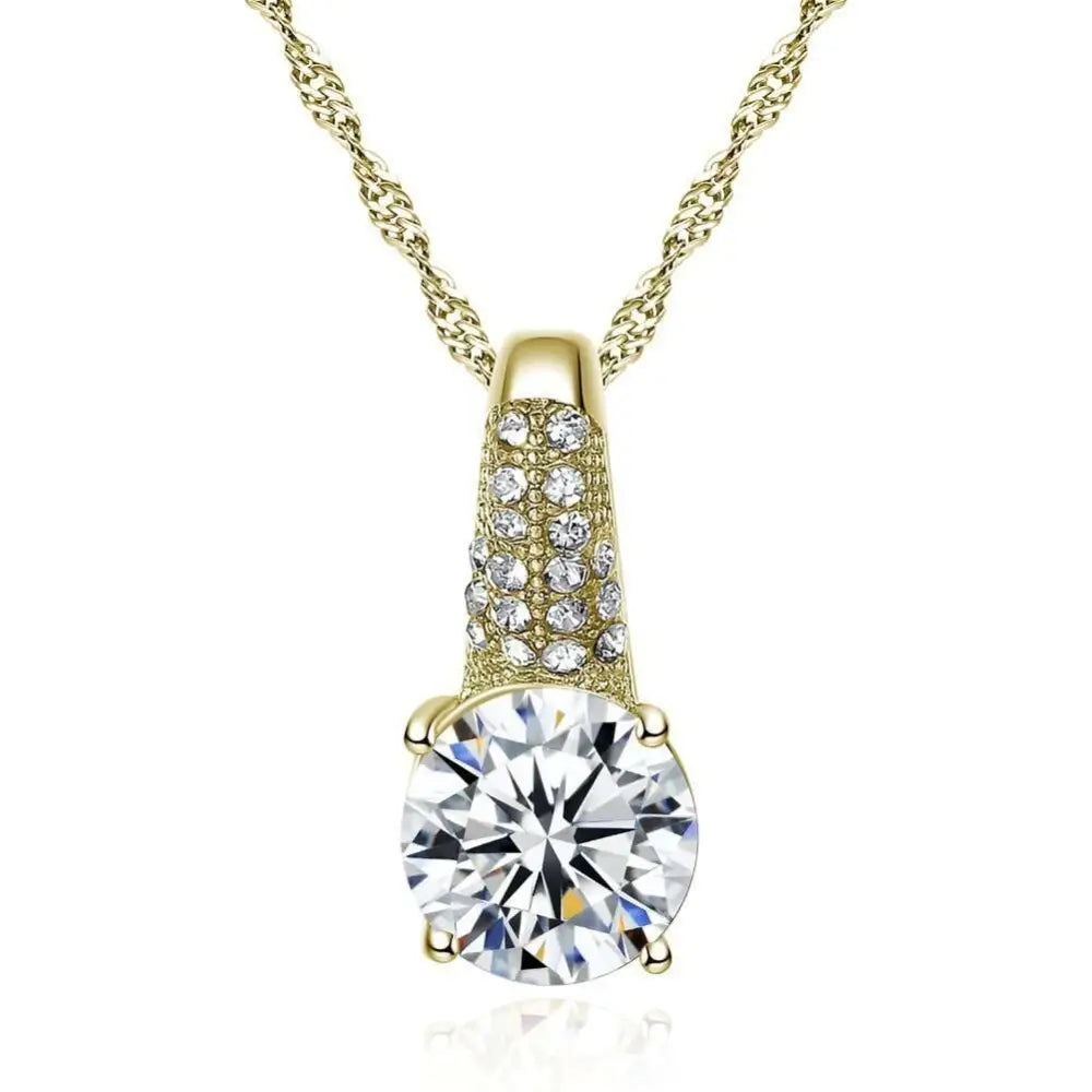 Gold bridal necklace featuring a gold-toned pendant with a round-cut clear gemstone and multiple smaller sparkling stones