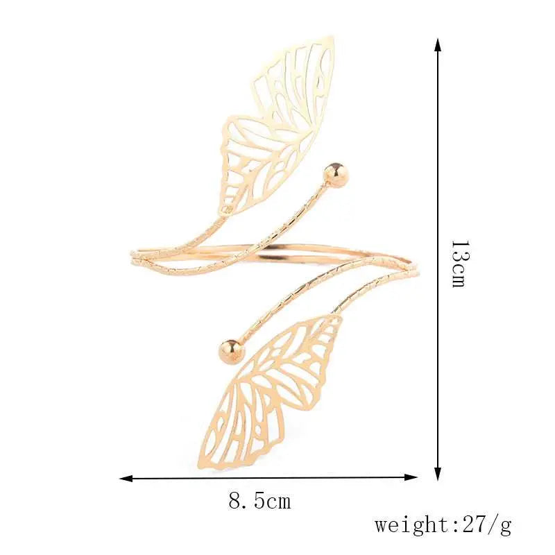 Gold-toned butterfly arm cuff with intricate cut-out detailing and small spherical accents for fashion personality trend