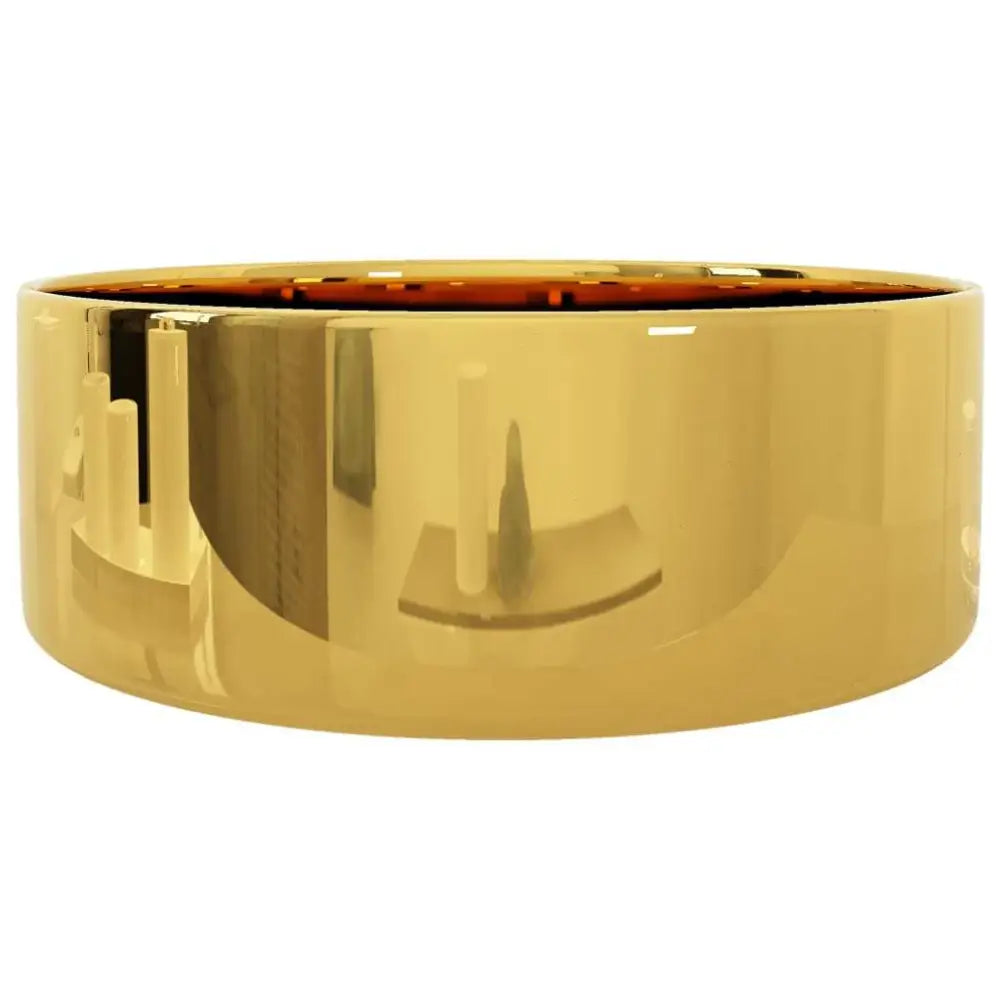 A sleek wide gold band ring with a polished surface for a gold ceramic wash basin 40x15 cm drain hole diameter