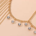Gold crystal long tassel head chain featuring gold-toned body chain with dangling clear crystal charms for hair accessory