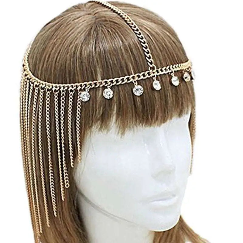 Gold-toned tassel head chain adorned with gold crystal beads and cascading chains for elegant head chain hair accessory