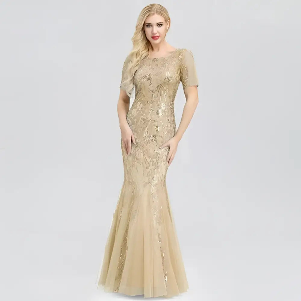 Gold embellished temperament mermaid dress featuring intricate sequin embroidery and sheer short sleeves