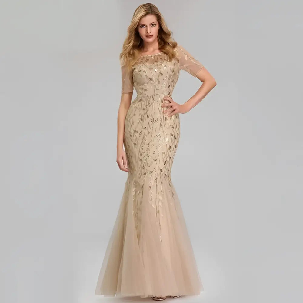 Gold embellished temperament mermaid dress featuring intricate sheer lace sleeves and a flowing tulle skirt