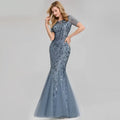 A sophisticated blue temperament mermaid dress featuring intricate gold embellished lace and sequin detailing with short sleeves