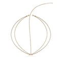 Gold-toned pearl tassel headband with gold filigree pearl design featuring layered rhinestone chains and central clasp