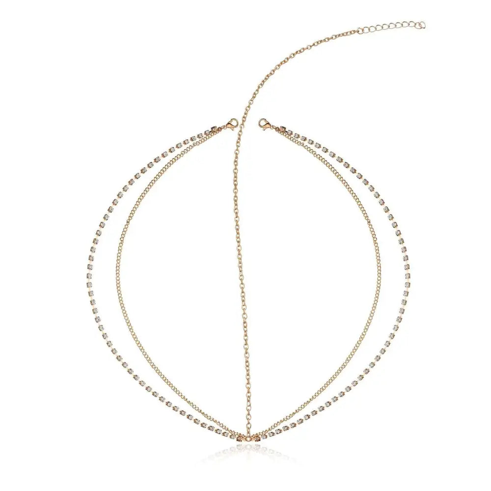 Gold-toned pearl tassel headband with gold filigree pearl design featuring layered rhinestone chains and central clasp