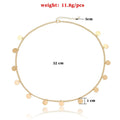 Gold-toned chain anklet with flat circular discs complementing gold filigree pearl tassel headband hair accessories