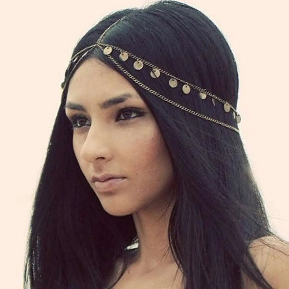 Gold filigree pearl tassel headband features a delicate gold-toned design with coin-like charms and fine chains