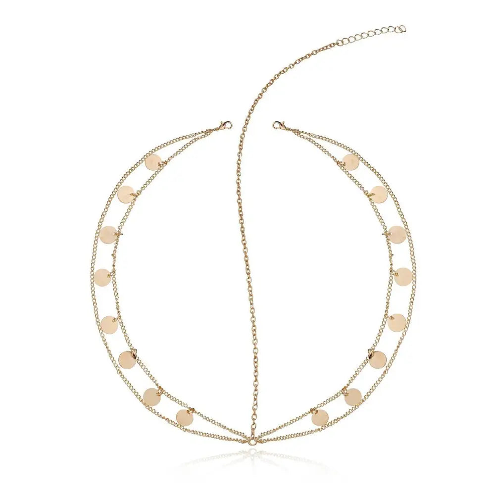 Gold filigree pearl tassel headband with gold-toned chain links and flat circular discs for elegant hair styling
