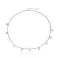 Silver chain choker necklace with small flat discs complementing gold filigree pearl tassel headband hair accessories