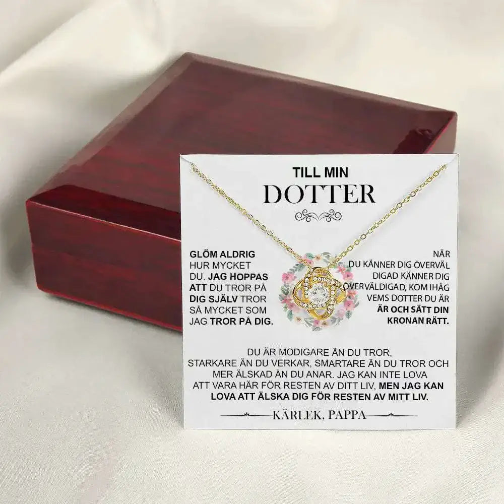 Gold floral knot daughter’s love necklace with a gold-toned pendant featuring a clear central stone in an ornate design