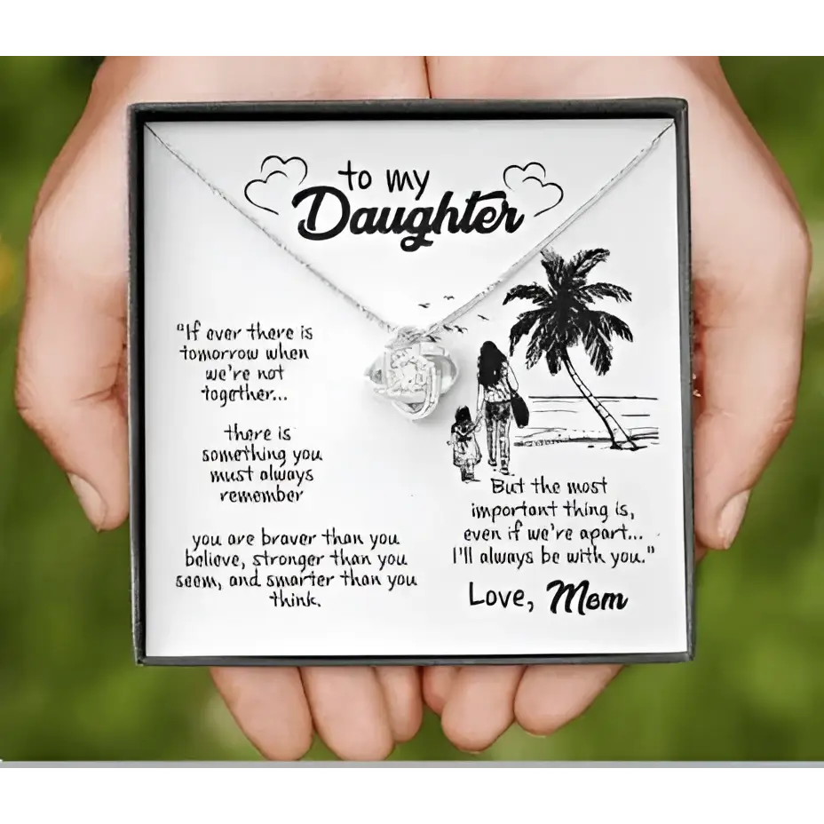 Silver heart-shaped pendant necklace with delicate chain in gift box featuring illustrated daughter’s love necklace message