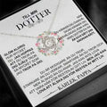 Silver infinity knot pendant necklace with clear central and smaller stones displayed on a gold floral knot daughter’s love necklace gift card
