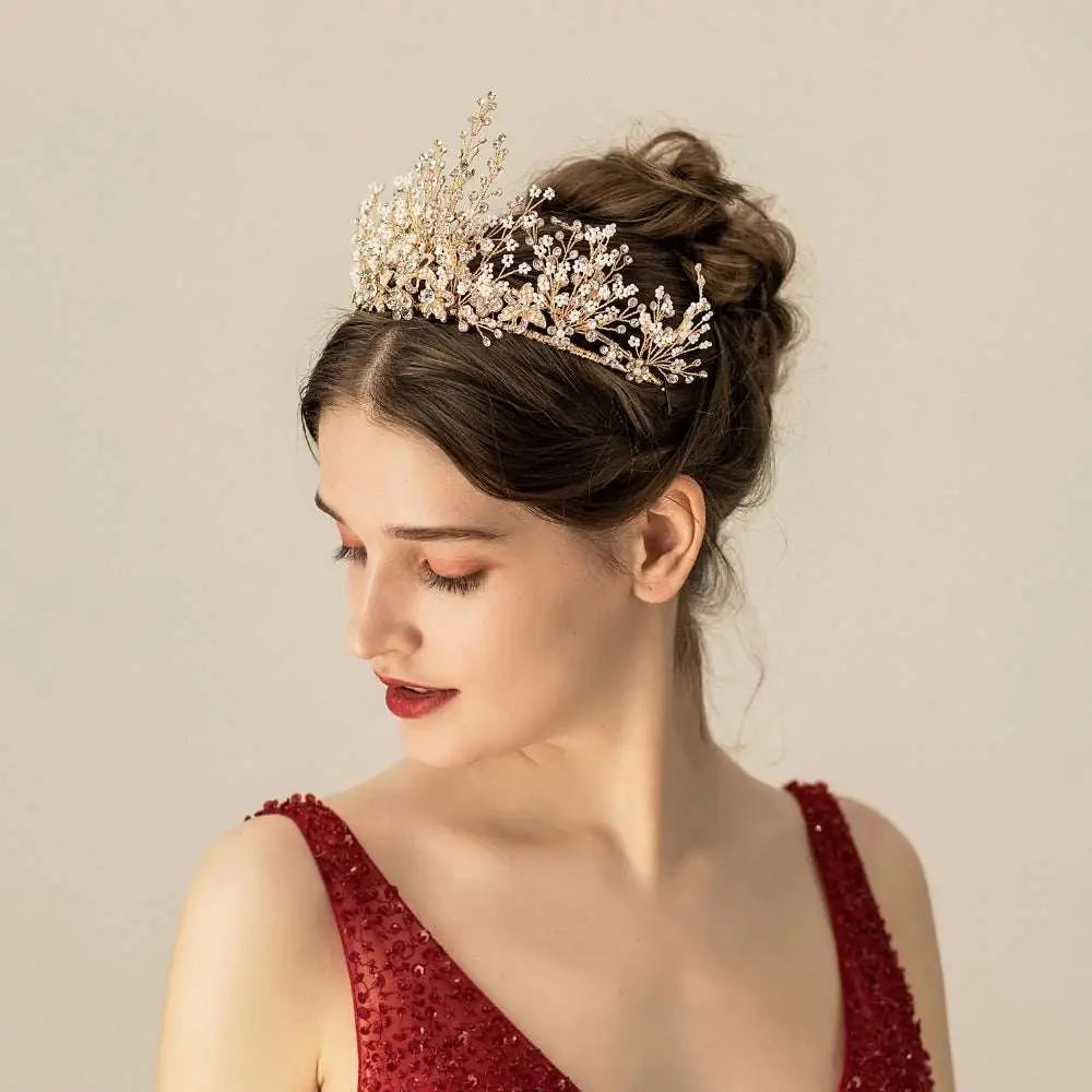 A delicate gold floral rice rhinestone bridal headwear featuring clear crystals and intricate floral designs