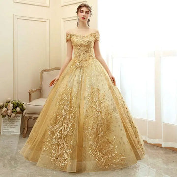 A shimmering gold floral solo performance off-the-shoulder tutu with intricate floral embroidery and voluminous tulle skirt