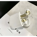 White and gold apple airpods pro with a gold glossy custom sticker skin in matching charging case