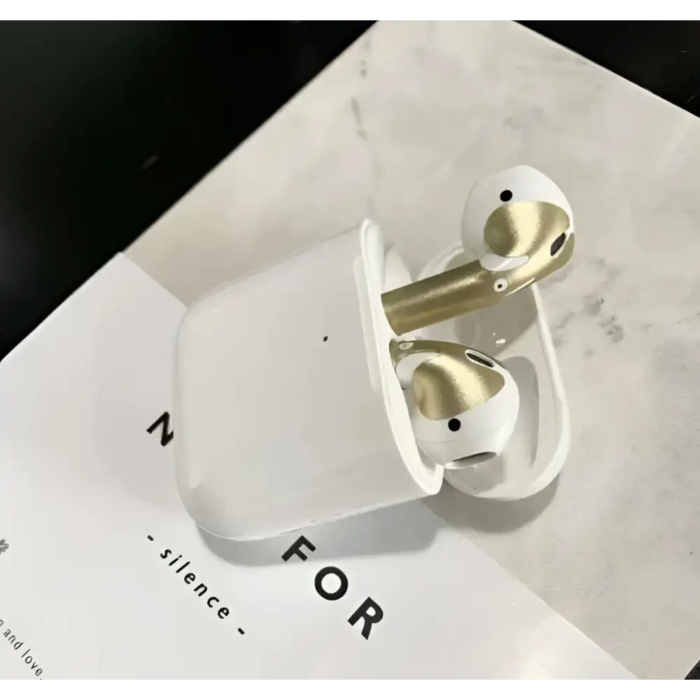 White and gold apple airpods pro with a gold glossy custom sticker skin in matching charging case