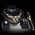 Gold leaf crystal bridal wedding jewelry set featuring gold leaf design with sparkling crystal accents for weddings
