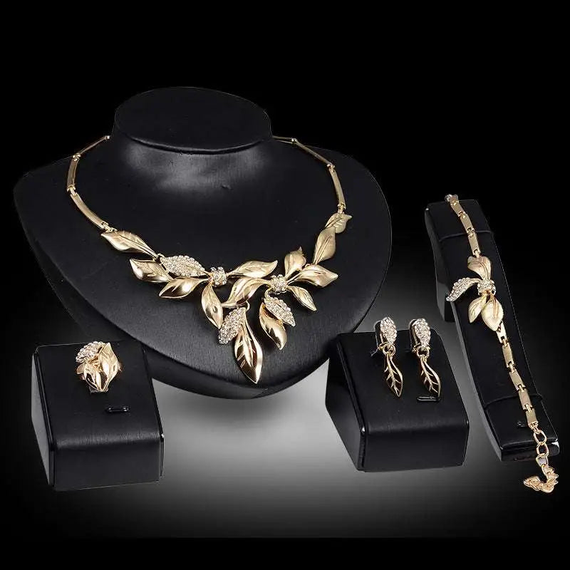 Gold leaf crystal bridal wedding jewelry set featuring gold leaf design with sparkling crystal accents for weddings