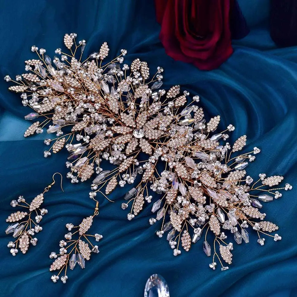 A gold luxurious exaggerated crystal leaf bridal headpiece with delicate gold tone and sparkling clear and rose gold crystals