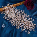 Delicate gold luxurious exaggerated crystal leaf bridal headpiece with clear and rose gold floral crystals