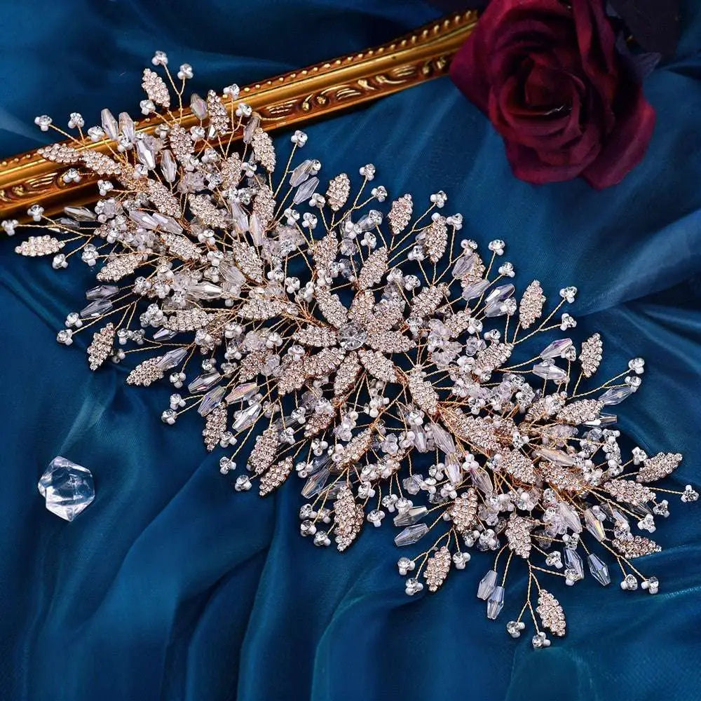 Delicate gold luxurious exaggerated crystal leaf bridal headpiece with clear and rose gold floral crystals