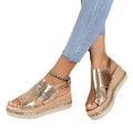 Gold metallic plus size rope wedge sandals with woven espadrille sole and crisscross strap design