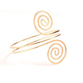 Gold-toned spiral arm ring cuff bracelet featuring an elegant open-ended coiled design in sleek minimalist style