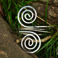 Silver spiral wire cuff bracelet with sleek minimalist design as elegant arm ring jewelry accessory