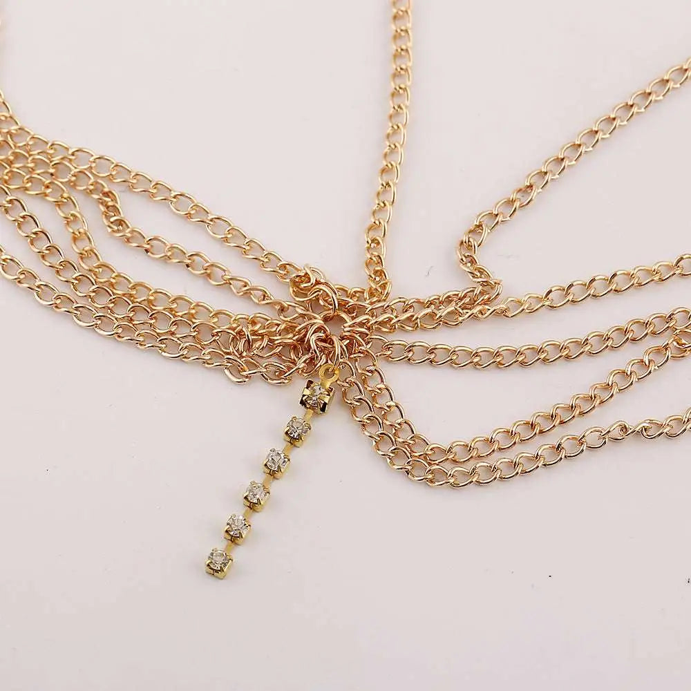 Gold multi layer tassel inlaid diamond head chain featuring multiple gold-toned chains and a rhinestone pendant
