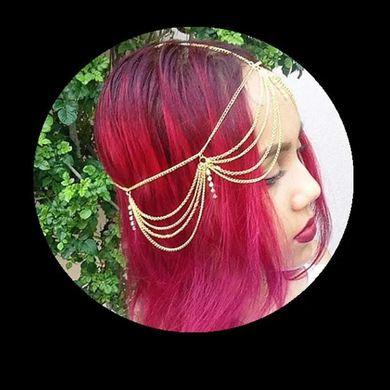 Gold multi layer diamond head chain featuring tassel inlaid diamond and a central dangling crystal detail