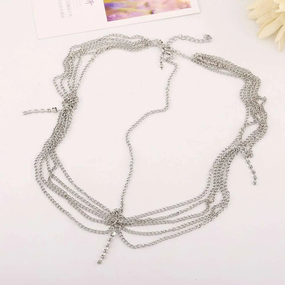 Silver multi-strand chain choker with delicate links and central clasp complementing gold multi layer tassel inlaid diamond head chain