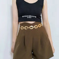 Gold-toned jewelry waist chain with interlocking oval links and matching dangling chain perfect for summer jewelry waist