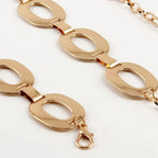Gold-toned oval link jewelry waist chain with polished metallic finish and lobster clasp for summer jewelry waist wear