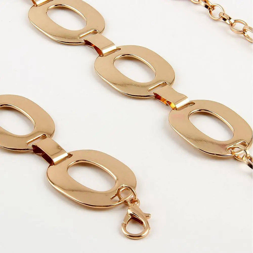 Gold-toned metallic jewelry waist chain with double-layered oval link design and dangling rose charm for summer jewelry waist