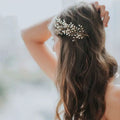 Delicate gold-toned gold pearl branch outdoor hair comb adorned with tiny white pearls for bride wedding use