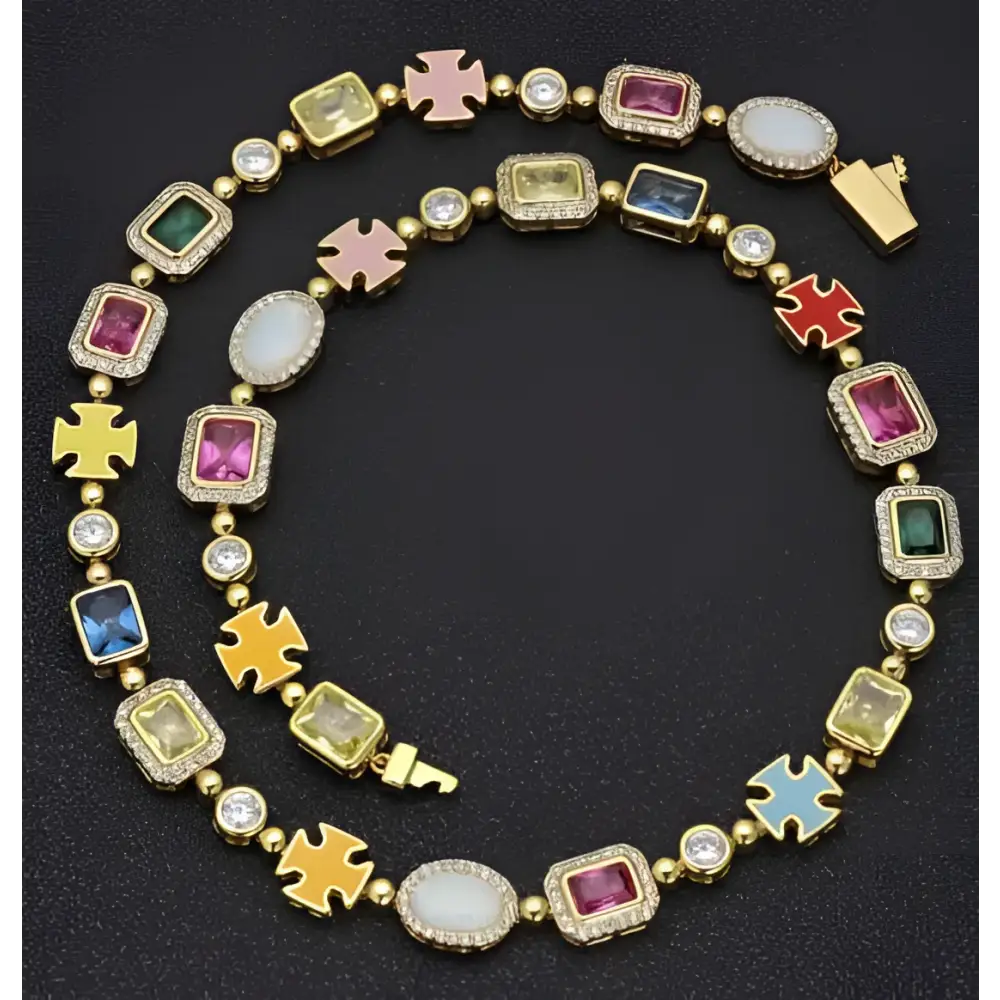 A gold plated hip-hop gemstone necklace featuring vibrant enamel crosses and colorful gemstone accents with bracelet set