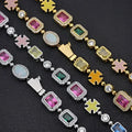Gold plated hip-hop gemstone bracelet set with multi-colored square-cut stones and gold and silver-toned metal links