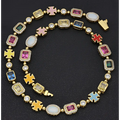 Gold plated hip-hop gemstone necklace and bracelet set with vibrant enamel crosses and multicolored rectangular gemstones