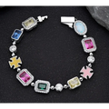 Gold plated hip-hop gemstone necklace and bracelet set with colorful blue pink green yellow stones encased in clear crystals