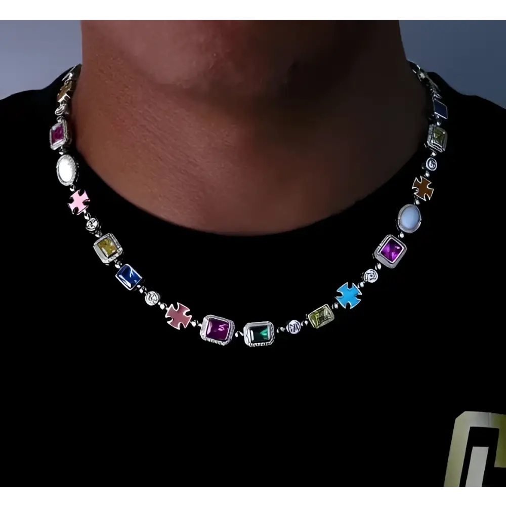 A vibrant multi-colored hip-hop gemstone necklace and bracelet set with gold plated metal and cross-shaped charms