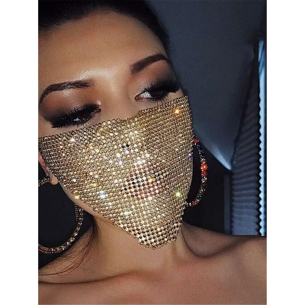 A dazzling gold rhinestone explosive metal flash jewelry mask featuring a dense sparkling array of rhinestones