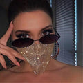 A gold rhinestone explosive metal flash jewelry mask with a shimmering mesh design worn over nose and mouth