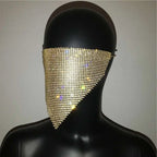 A gold rhinestone mesh face veil designed as an explosive metal flash jewelry mask with shimmering detail