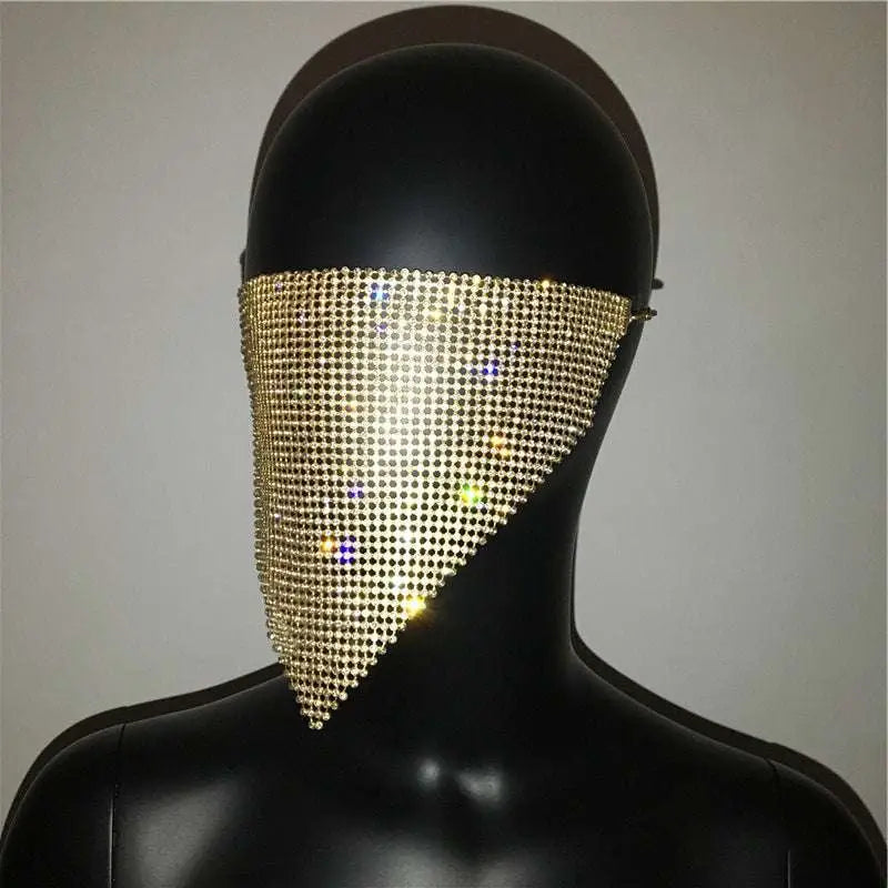 A gold rhinestone mesh face veil designed as an explosive metal flash jewelry mask with shimmering detail