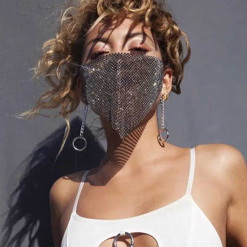 A silver mesh flash jewelry mask with shimmering rhinestones featured in the gold rhinestone explosive metal flash collection