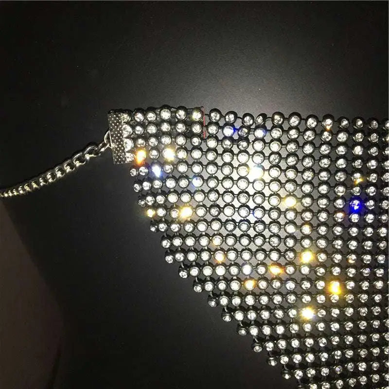 A silver mesh choker with clear and blue rhinestones and metal clasp for a gold rhinestone explosive metal flash jewelry mask