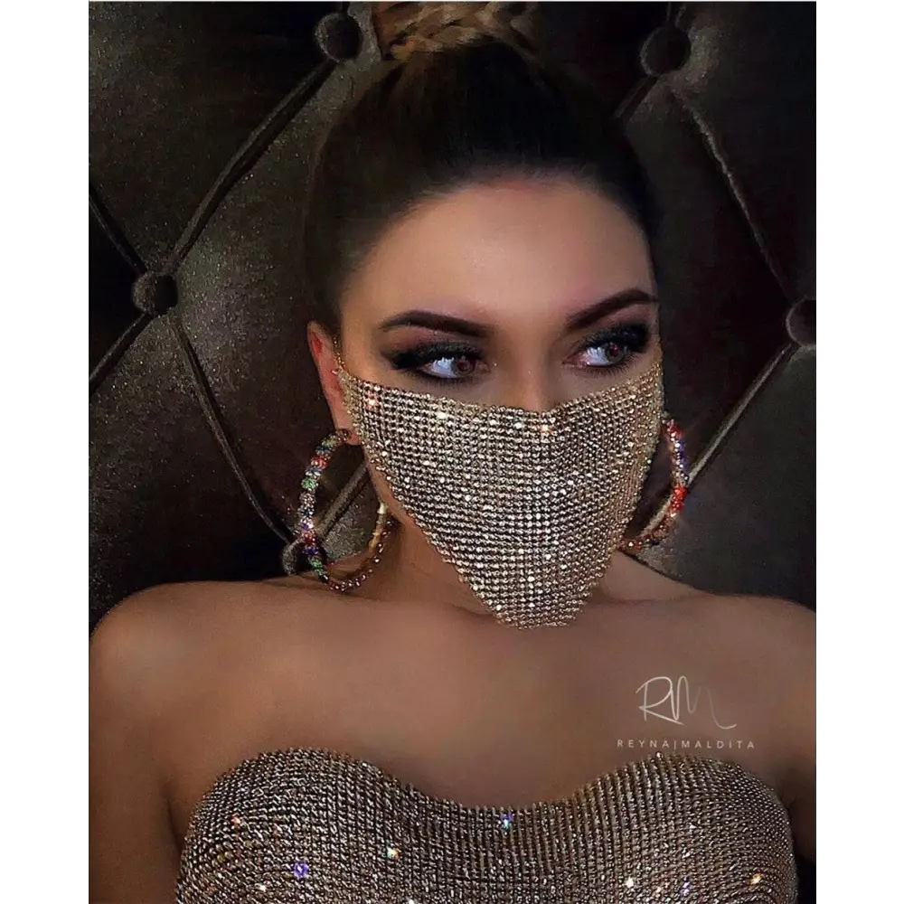 A sparkling gold rhinestone flash jewelry mask featuring an explosive metal flash design with dense crystal patterns